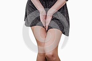 Pelvic thigh young woman with hands holding pressing her crotch of the lower abdomen. Medical or gynecological health problems photo