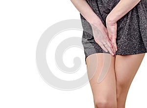 Pelvic thigh young woman with hands holding pressing her crotch of the lower abdomen. Medical or gynecological health problems