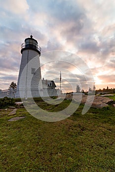 Pemaquid Point Lighthouse in Bristol, Maine, at sunset on a summer evening
