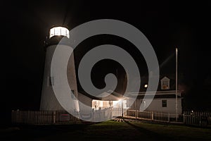 Pemaquid Point Lighthouse and Keepers House in Foggy Night photo