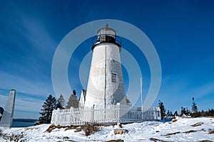 Pemaquid Point Lighthouse and Keepers House  during winter, Maine, USA photo