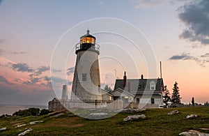 Pemaquid Point Lighthouse at sunset during a calm summer evening in Bristol, Maine