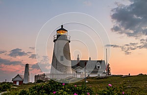 Pemaquid Point Lighthouse at sunset during a calm summer evening in Bristol, Maine