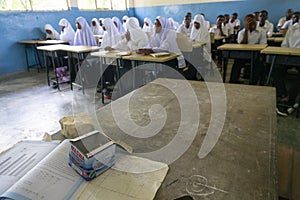 PEMBA ISLAND, ZANZIBAR, TANZANIA - JANUARY 2020: School girls and School Boys in the Ordinary class room With a Teachers