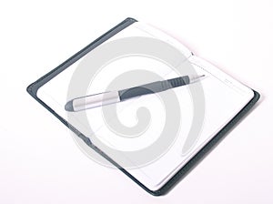 Pen on blank notebook