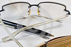Pen book and glasses
