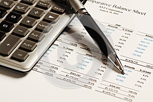 Pen And Calculator On Comparative Balance Sheet