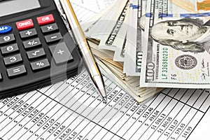 Pen, calculator and money on document with financial data