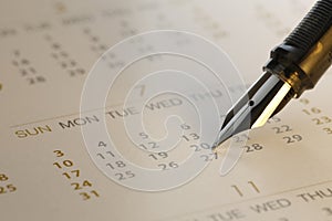 Pen and calendar close-up - Stock Image