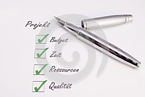 Pen with check marks photo
