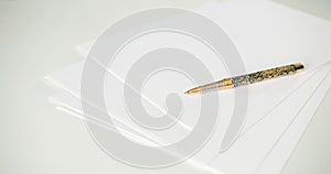 A pen on clean white blank sheets of paper