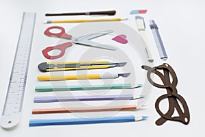 Pen Color Pencil Scissor Eraser Ruler Eyeglasses Concept