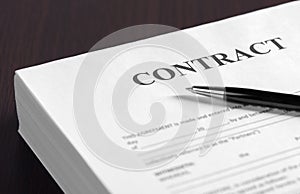 Pen on the contract papers