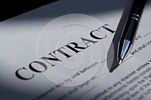 Pen on the contract papers document