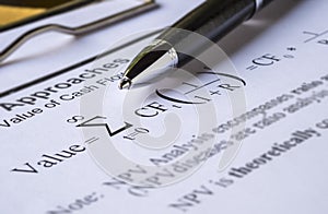 Pen on Discount cash flow model.