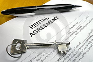 Pen and key on rental agreement