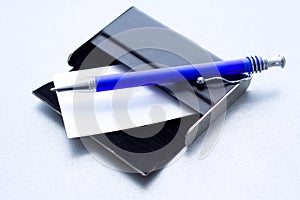 Pen laying on a case for cards