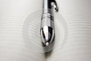 Pen laying over notebook