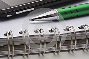 Pen, notebook and cell phone
