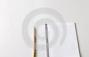Pen and notebook on a white background