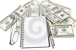 Pen, notepad and glasses