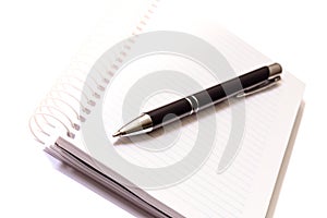 Pen and notepad on white background