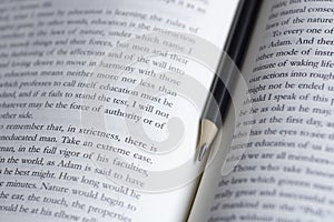 A pen on the open book