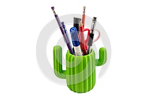 Pen and pencils in cactus shape glass isolated on white background