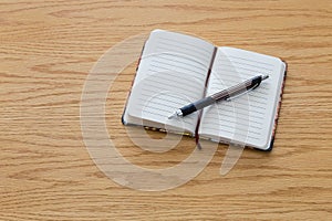 Pen on top of notebook