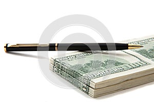 Pen on top of a stack of cash