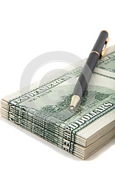 Pen on top of a stack of cash