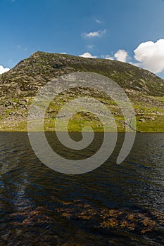 Pen yr Ole Wen mountain with Lake Llyn Ogwen in the foreground.