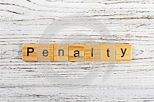 Penalty word made with wooden blocks concept
