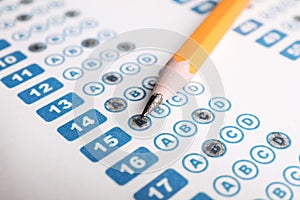 Pencil on answer sheet, closeup. Student passing exam