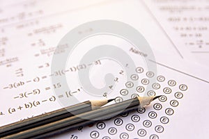 Pencil on answer sheets or Standardized test form with answers bubbled. multiple choice answer sheet