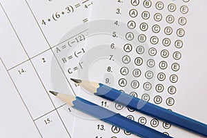 Pencil on answer sheets or Standardized test form with answers bubbled. multiple choice answer sheet