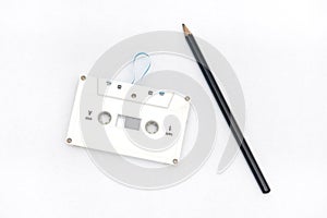A pencil and an audio cassette tape