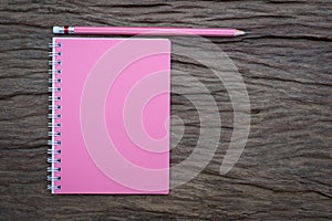 Pencil and book mockup on the old wood desk