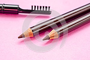 Pencil and brush for eyebrows makeup.