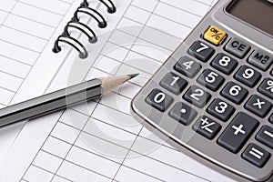 Pencil, calculator and account book