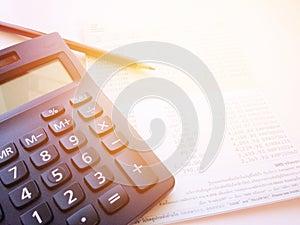 Pencil, calculator and savings account passbook or financial statement on white background