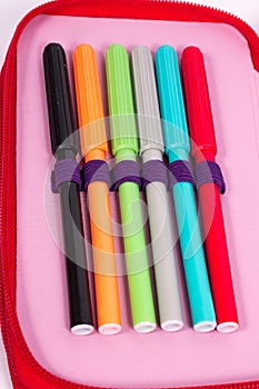 Pencil case with bright colored pens