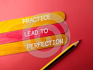 Pencil and colorful stick with the word PRACTICE LEAD TO PERFECTION