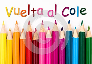 Pencil Crayons with text Vuelta al Cole - Back to School in Span