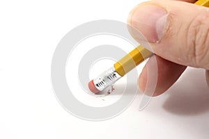 Pencil erasing on paper.