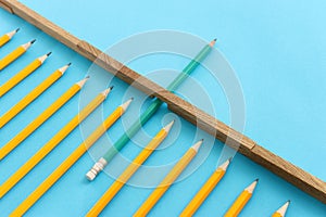 Pencil overcoming barrier obstacle. Concept of education, competition, and challenge