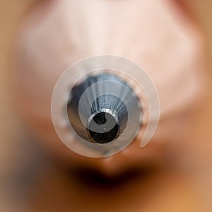 The pencil is positioned vertically emphasizing the sharp point