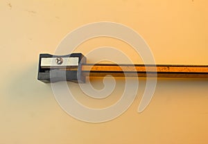 Pencil in a sharpener on white desk
