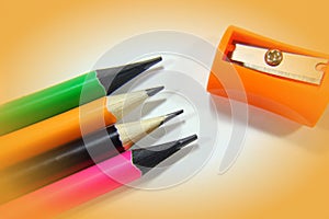 Pencil sharpeners and colored pencils in a pil