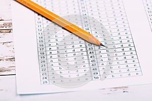 A pencil sitting on a test bubble sheet